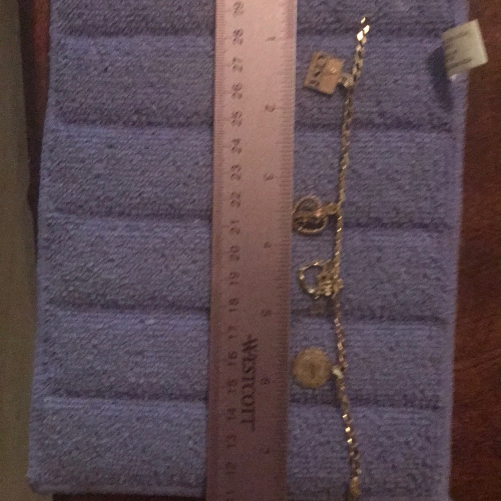 Gold charm bracelet with 4 charms